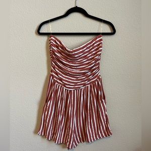 Strapless romper with pockets. Size large. Orange / rust color.